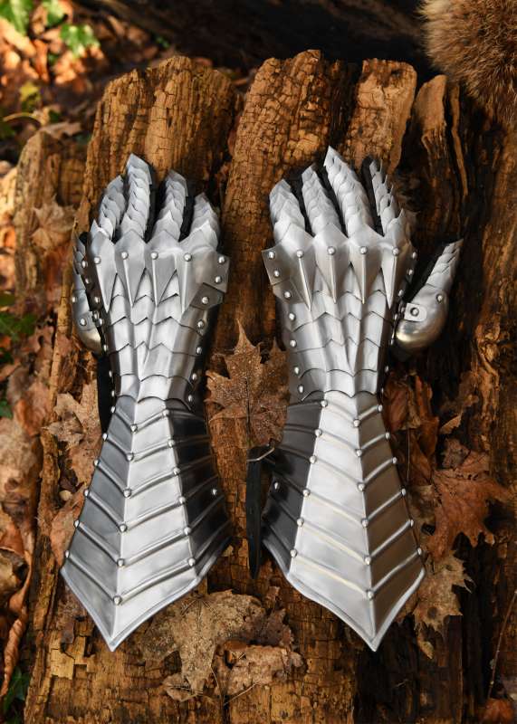 Gauntlets, polished, riveted and stitched.