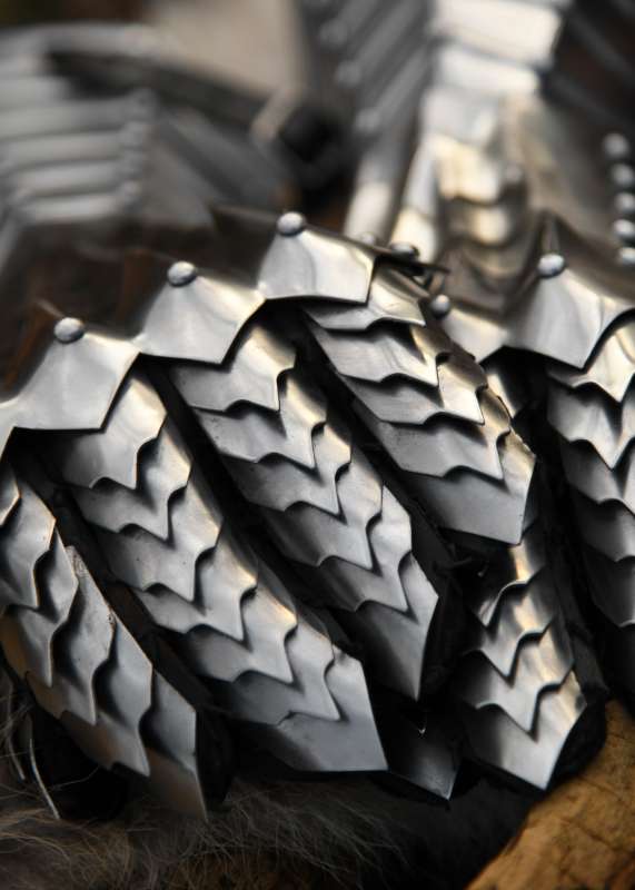 Gauntlets, polished, riveted and stitched.